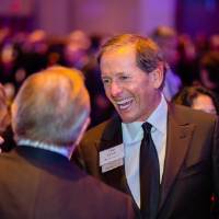 Dan DeVos speaking with Enrichment guests